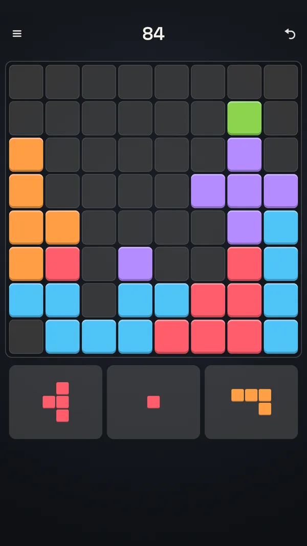A Blockful run in progress: the 8x8 grid with coloured blocks and three shapes waiting in the tray.